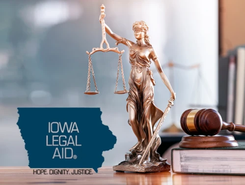 Lady Justice statue with Iowa Legal Aid logo