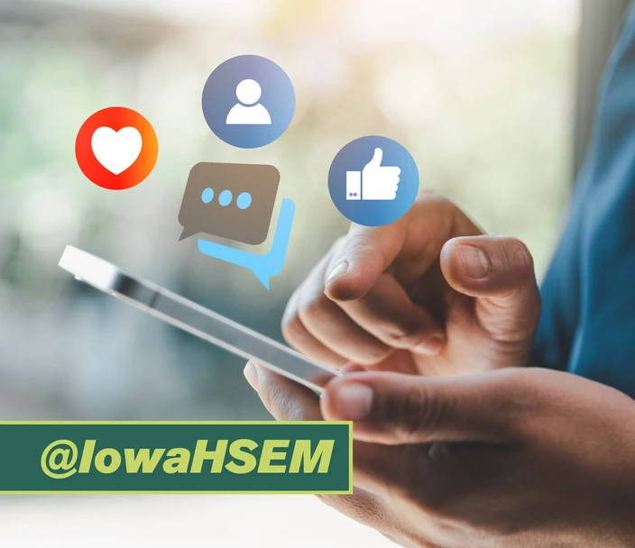 Person looking at cell phone and sharing, liking and commenting on social media. Follow @IowaHSEM.