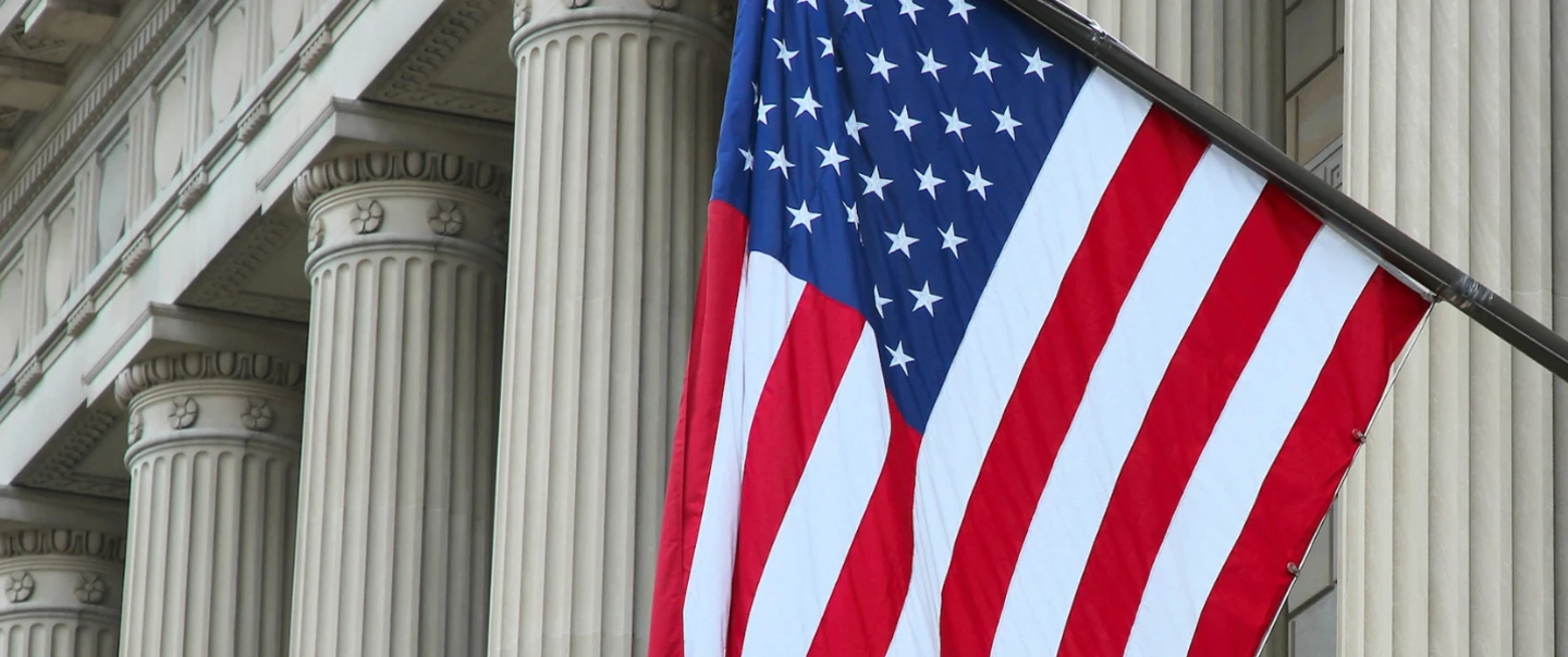 American flag flying in front of federal building